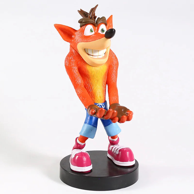 Figurine Crash Bandicoot™ en PVC de 22 cm, bras tendus pour support manette ou téléphone. Accessoire geek rétro pour fans PlayStation et gaming.
